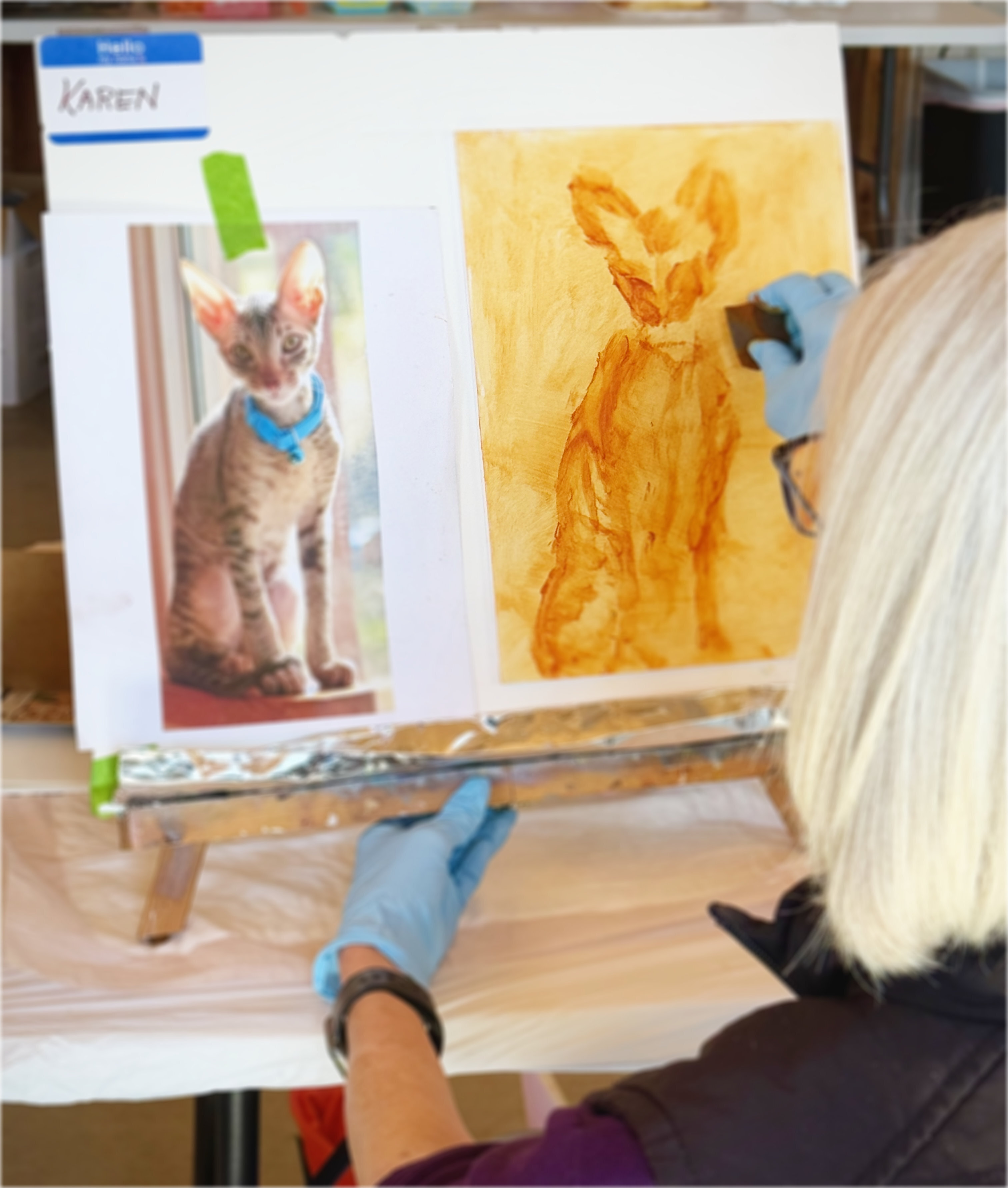 Artist working on a cat portrait