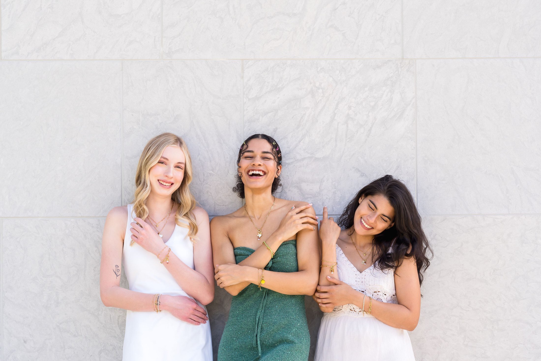 Charm Theory models posing against a wall in downtown Austin