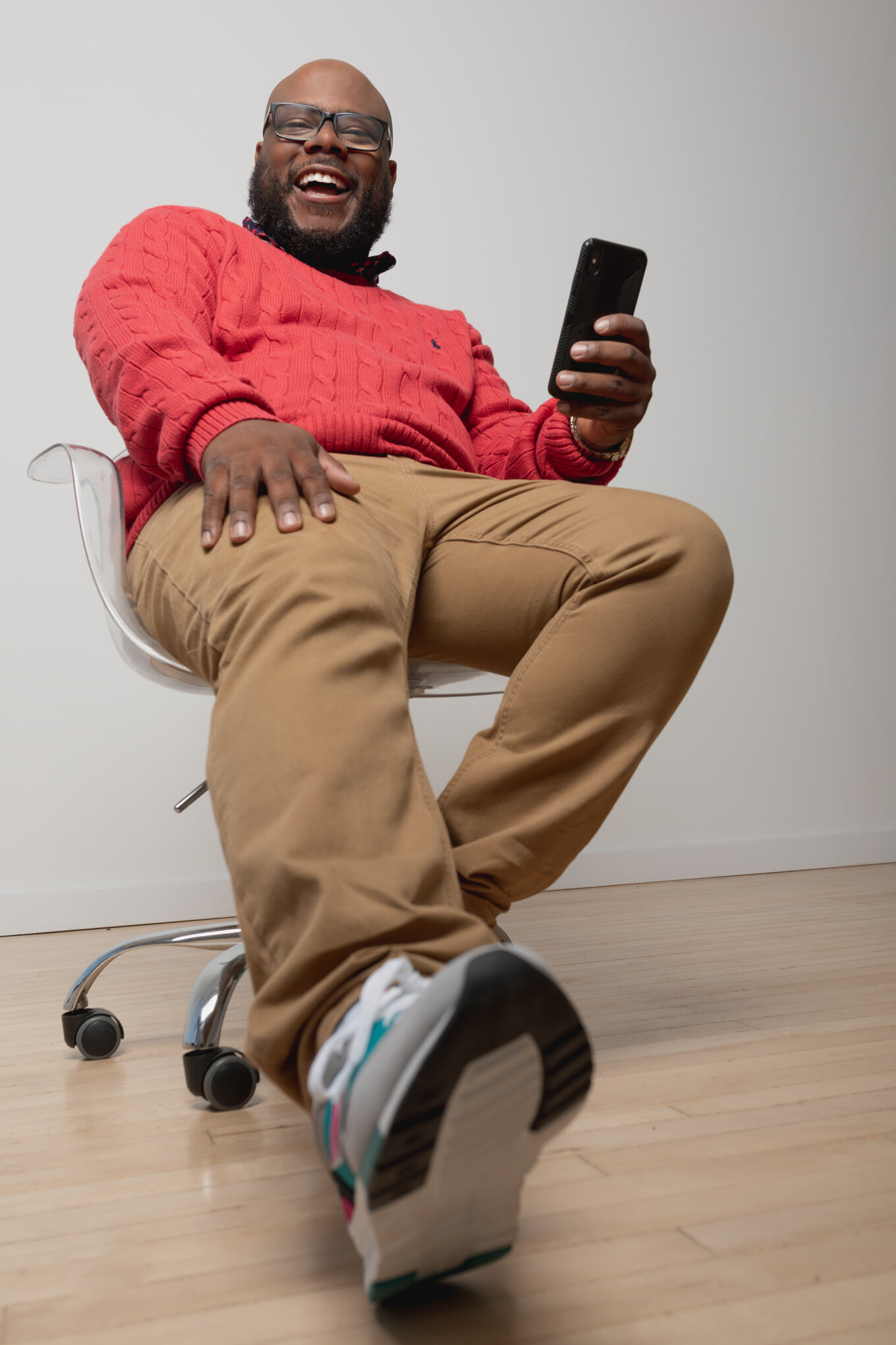 Lev Hunter laughing in red sweater