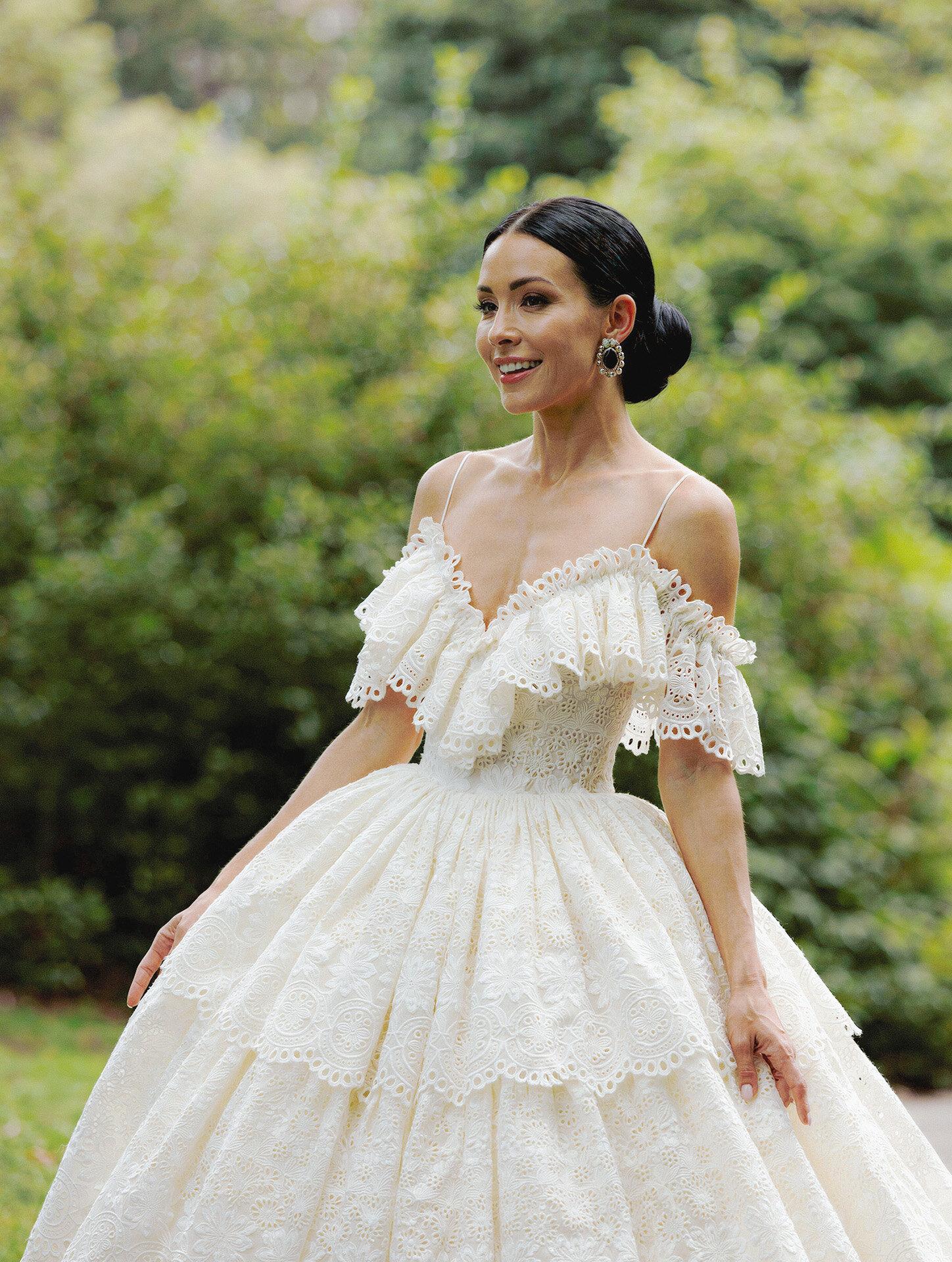 Bride in a lace wedding dress photographed in Central Park by a New York City wedding photographer