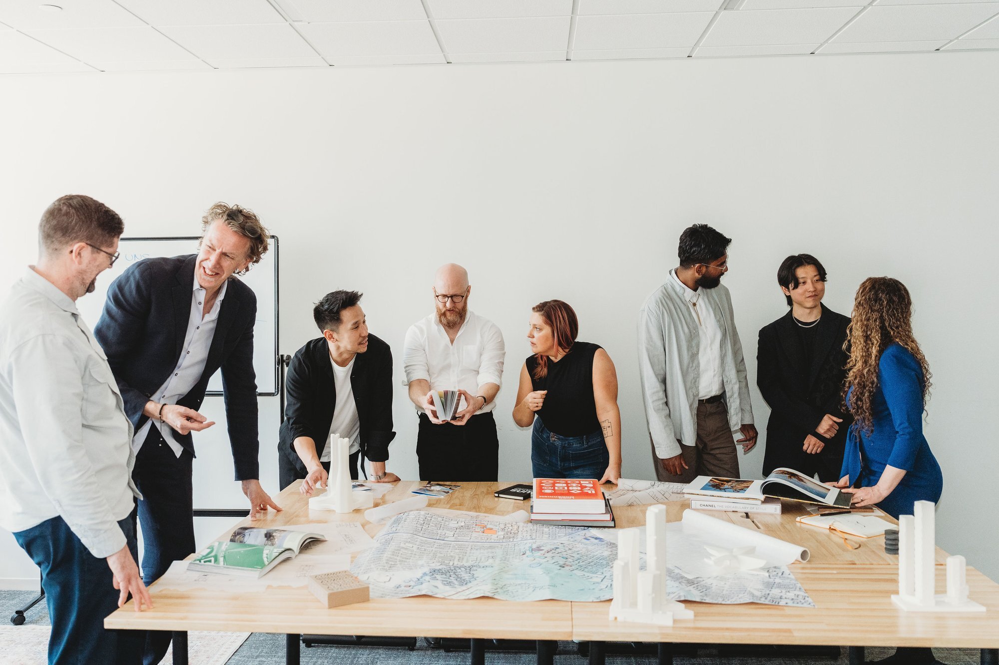 UNS architecture team collaborating at a conference table in Austin