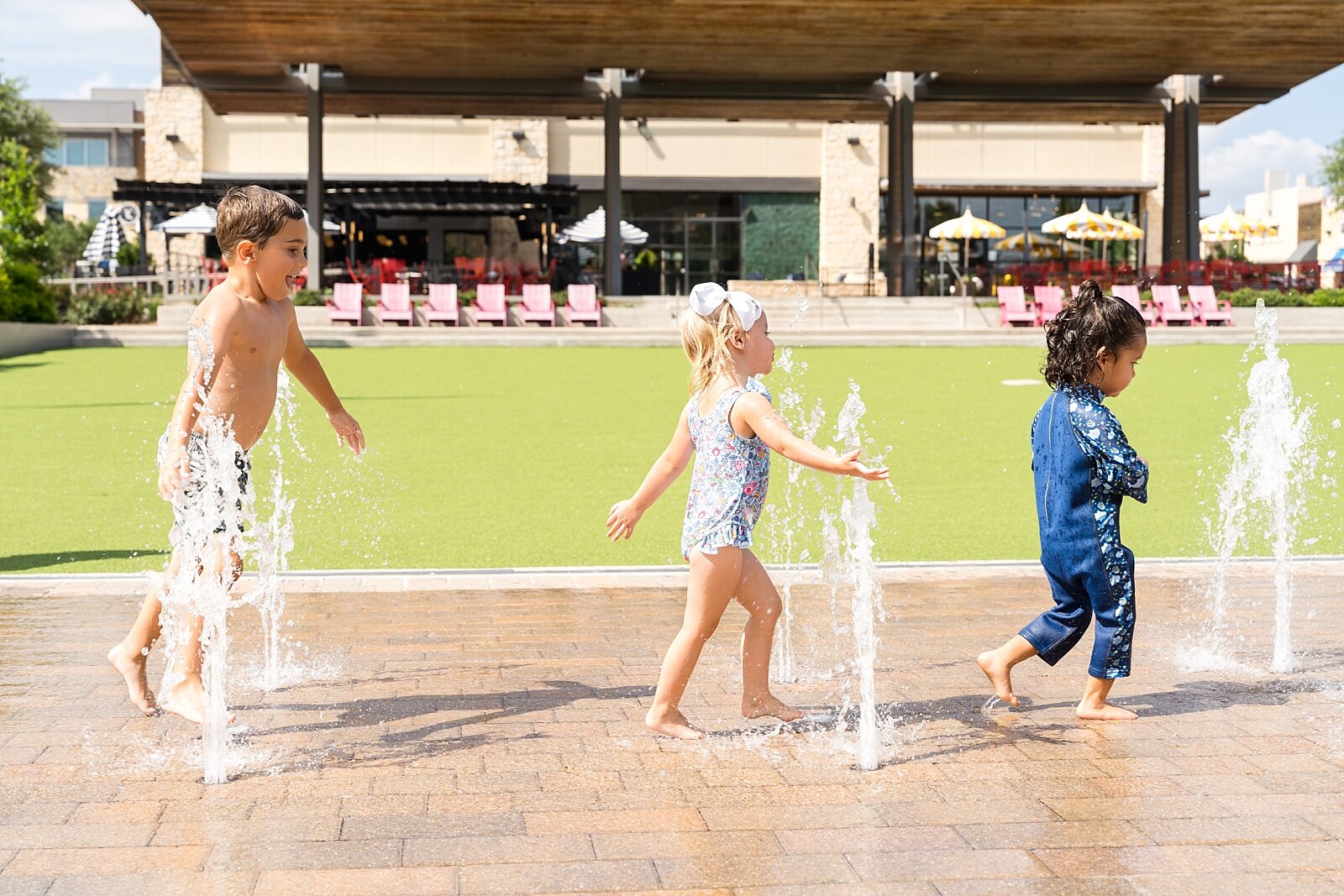 Kids playing at the splash pad at Hill Country Galleria
