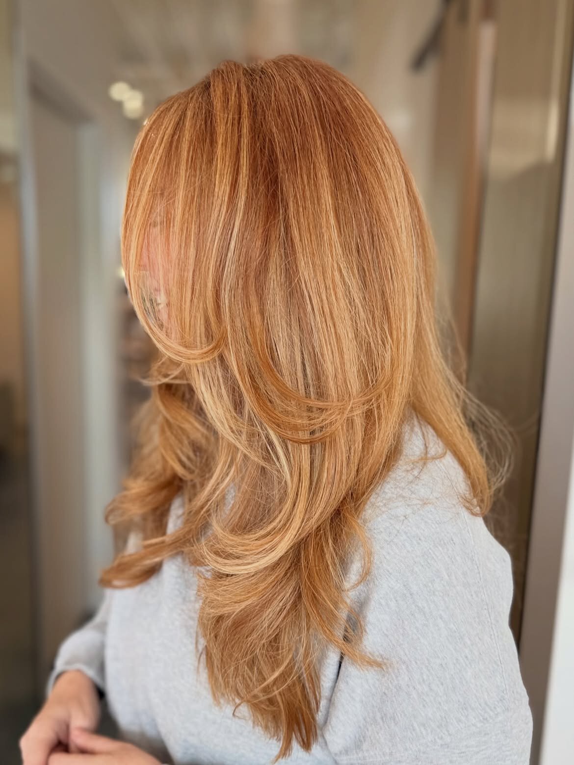 Red hair color and blowout done at our salon in Eagle, Idaho