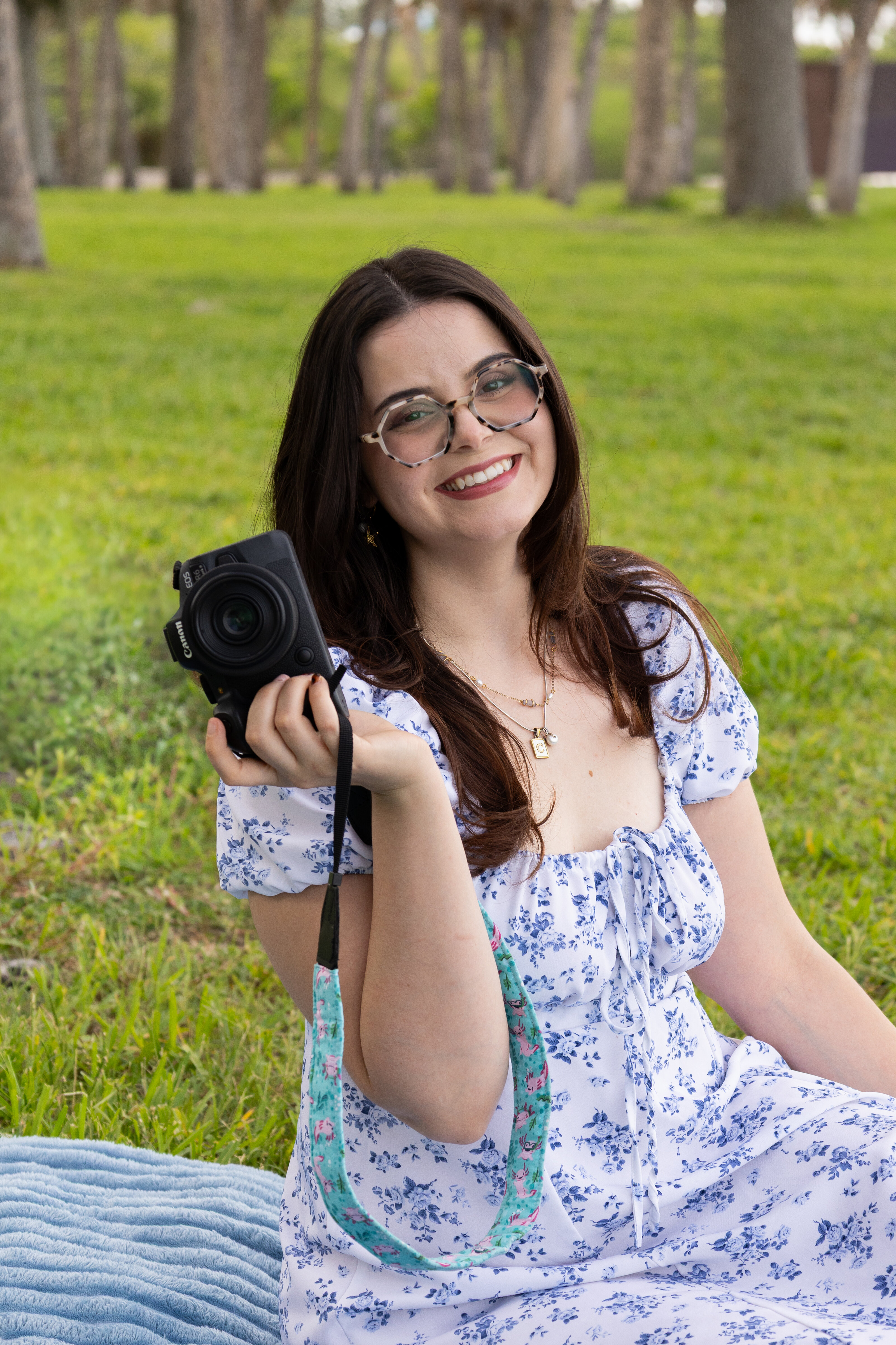 Abbey photographer from Kindwave Photography posing and smiling with camera