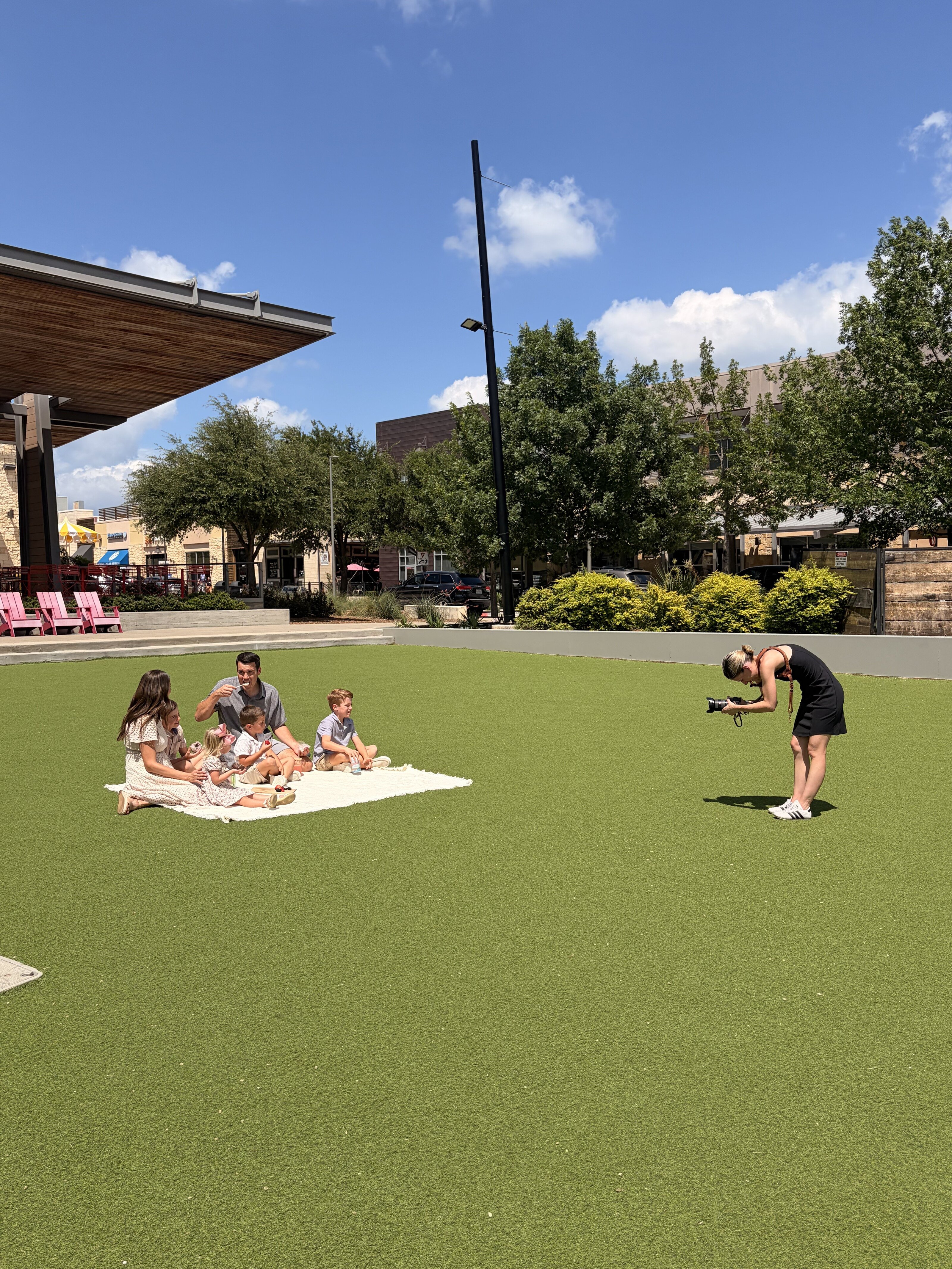 Behind the scenes of the photography shoot on the Plaza lawn at Hill Country Galleria