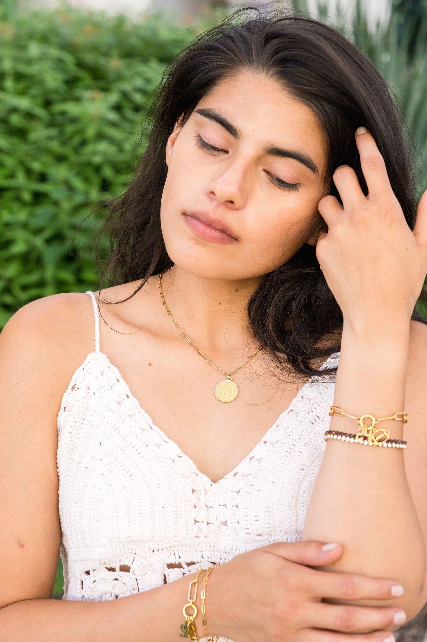 Charm Theory model wearing LOVE charm necklace