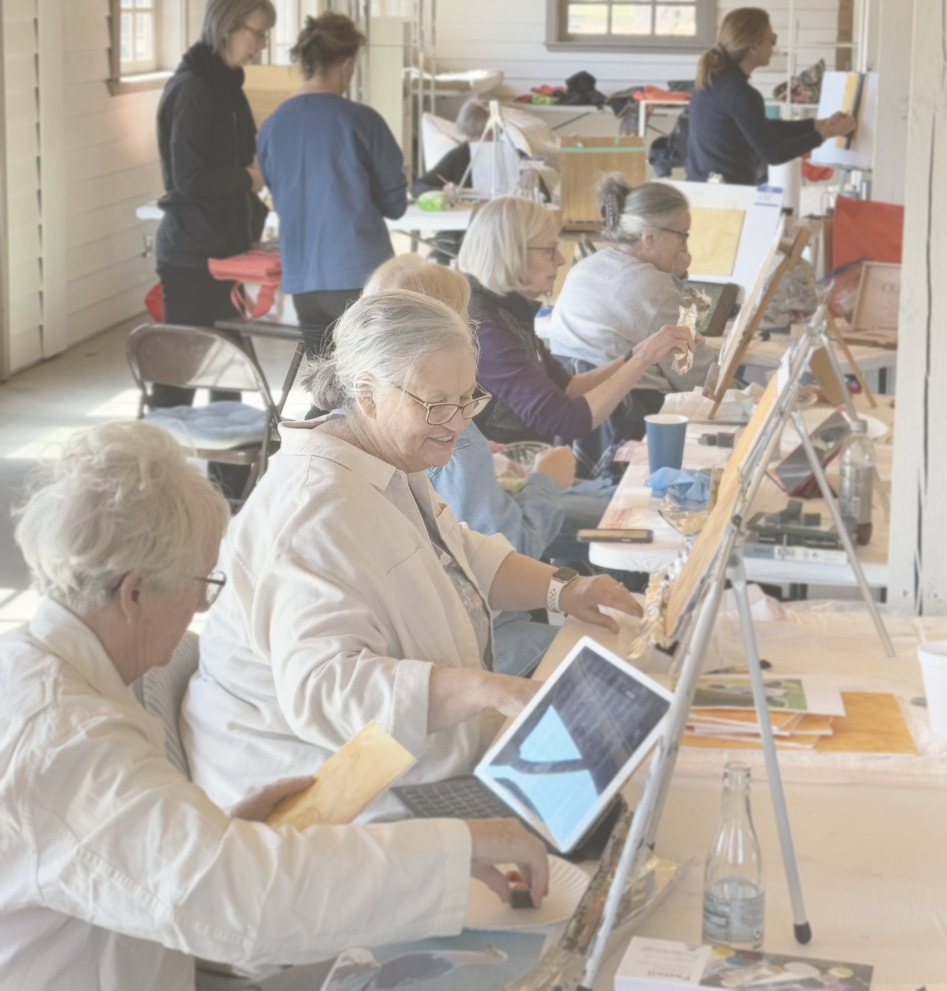 Artists painting at the Farmstead workshop