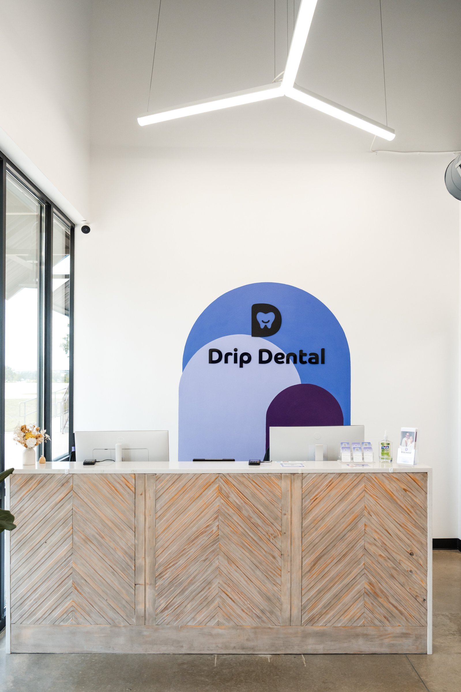 Drip Dental reception area branding and signage, Dripping Springs