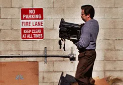 Ron Swanson from Parks & Rec throwing away a printer