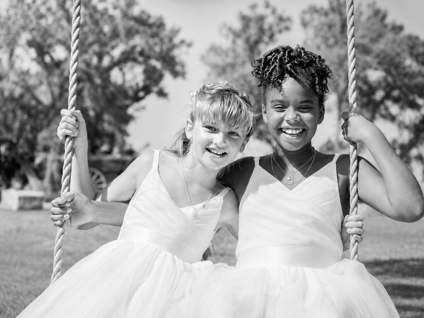 Black and white children on a swing