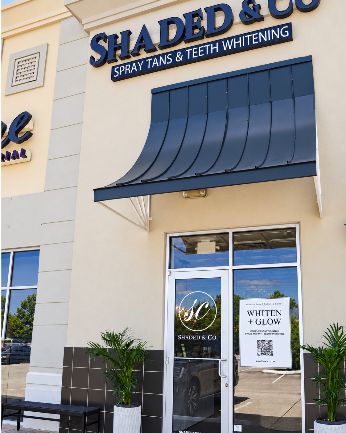 Shaded and Co storefront in Houston with navy awning and Whiten + Glow window signage