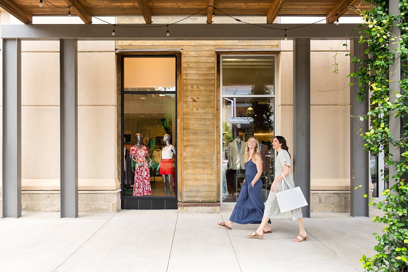 Women walking with shopping bags at Hill Country Galleria in Austin