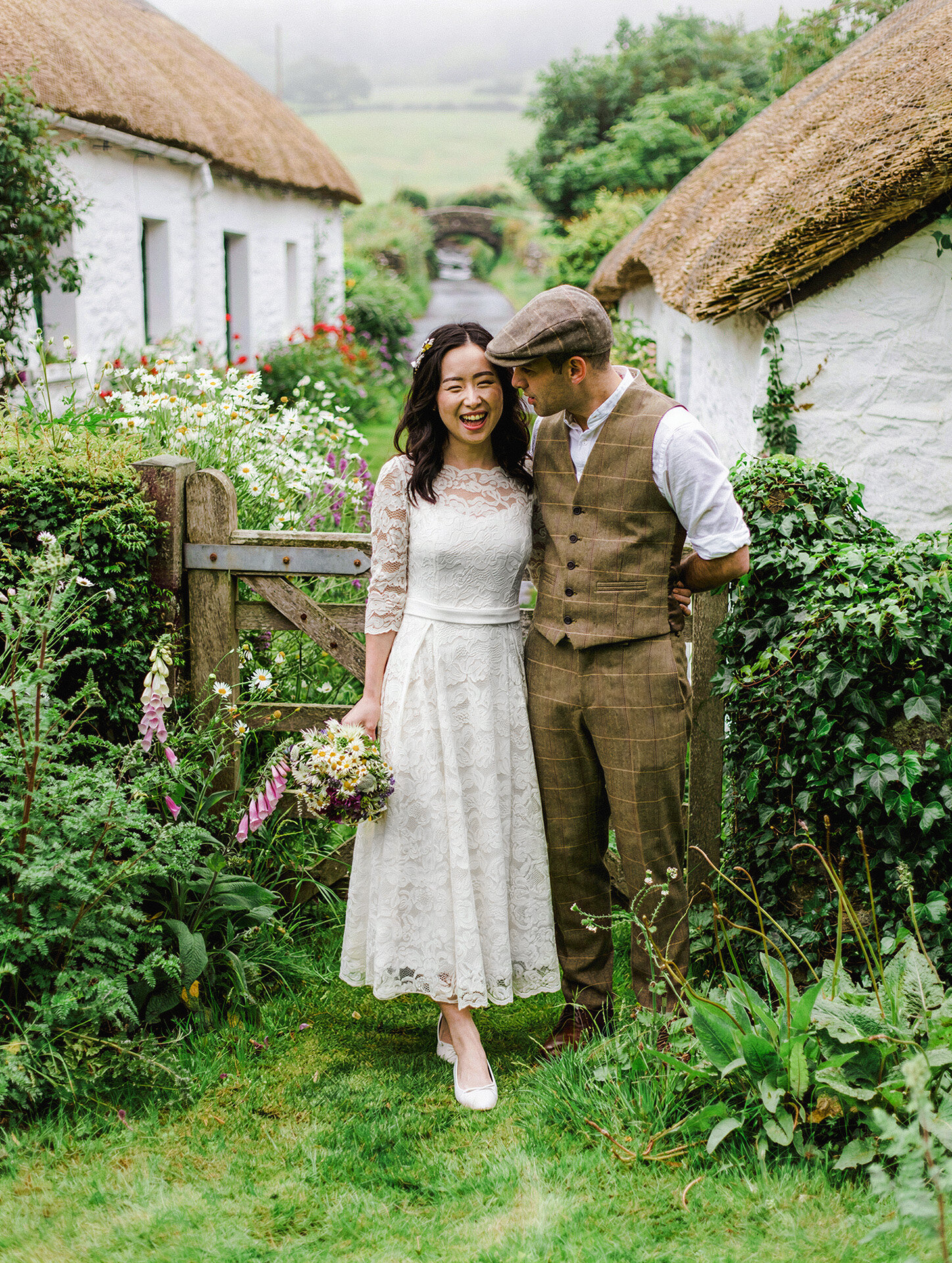 Bride and groom portrait at an old Irish farm by an Ireland wedding photographer and videographer