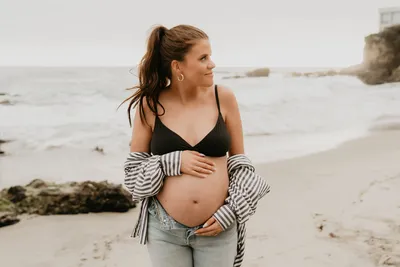 Editorial black and white maternity portrait in a sheer bralette