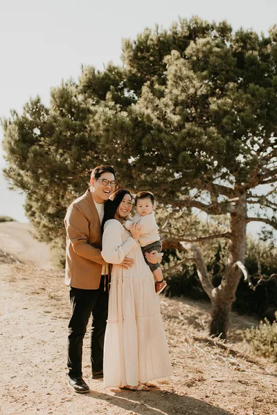 Family walking together along a coastal trail, extended family photography