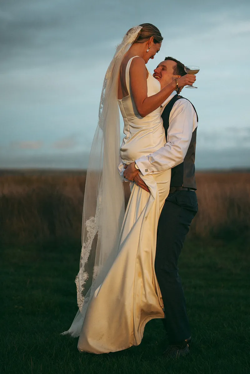 Bride and groom in the last of the evening light, Oxfordshire wedding