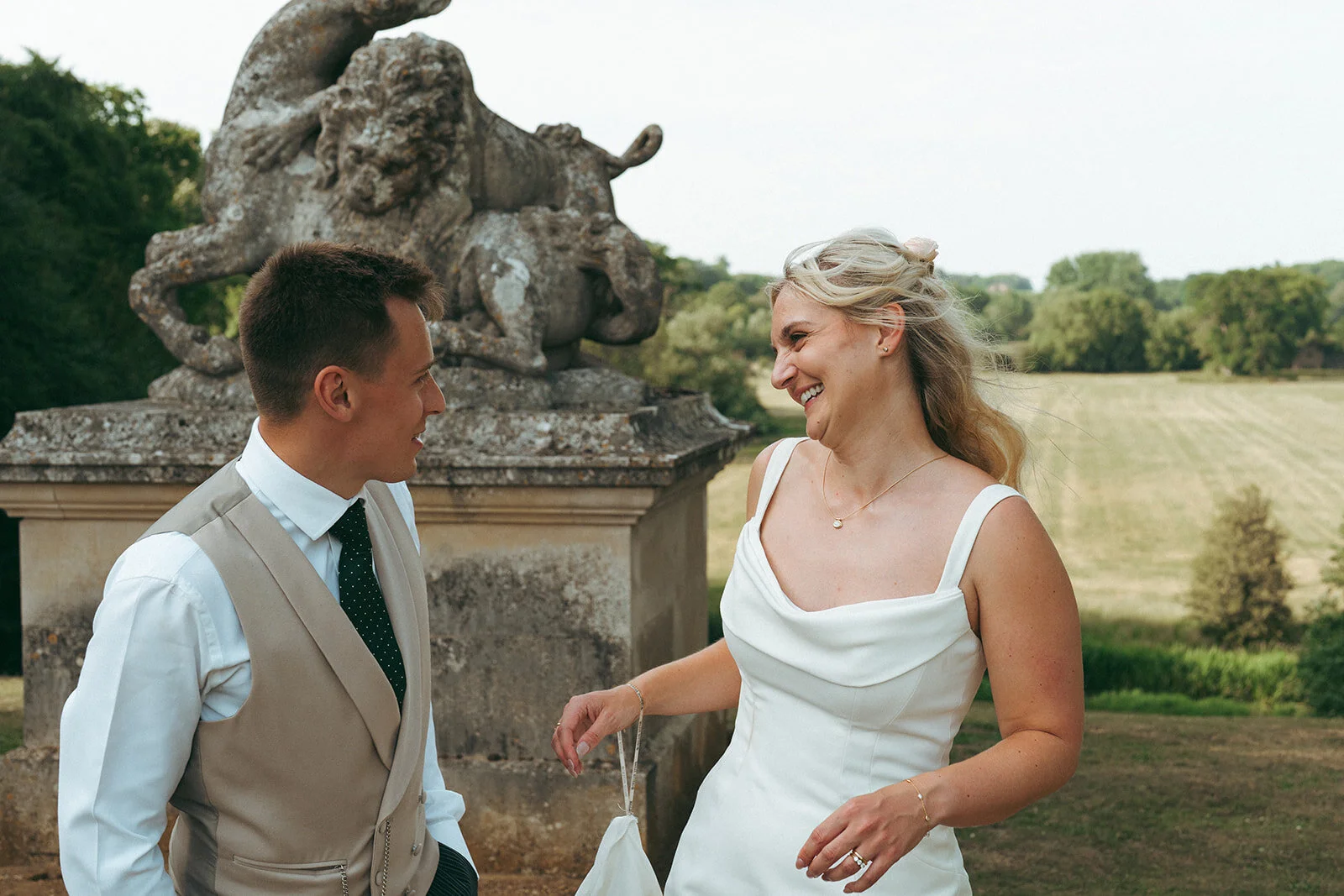 The couple on the lawn by the statue